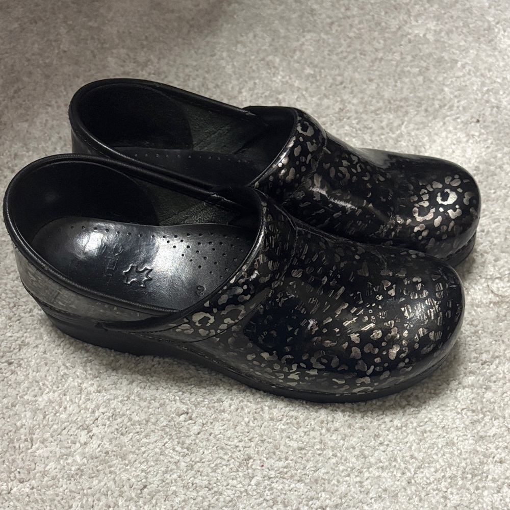 Dansko Black Metallic Leopard Clogs